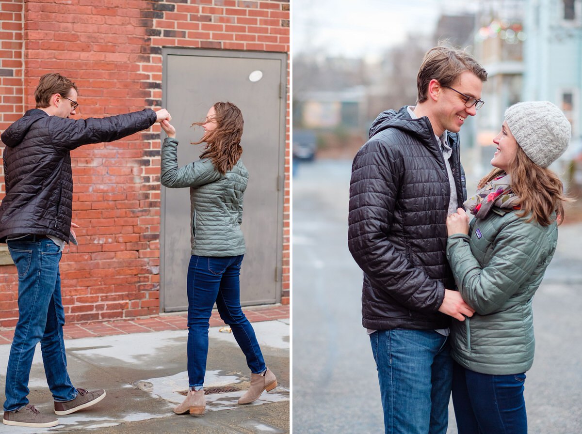 Engaged woman dances with her fiance during a winter engagement session in Somerville