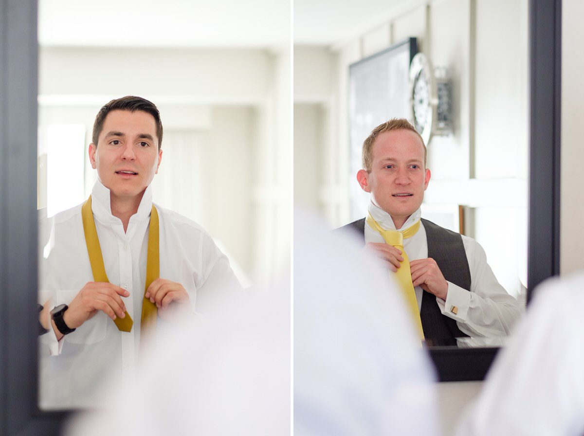 Groom & Groomsman getting ready in the mirror in the Charles Hotel in Cambridge, MA