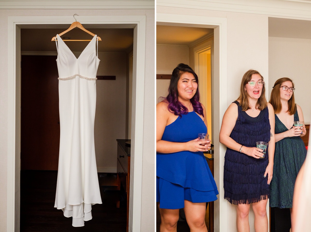 The brides dress hangs as her friends look on