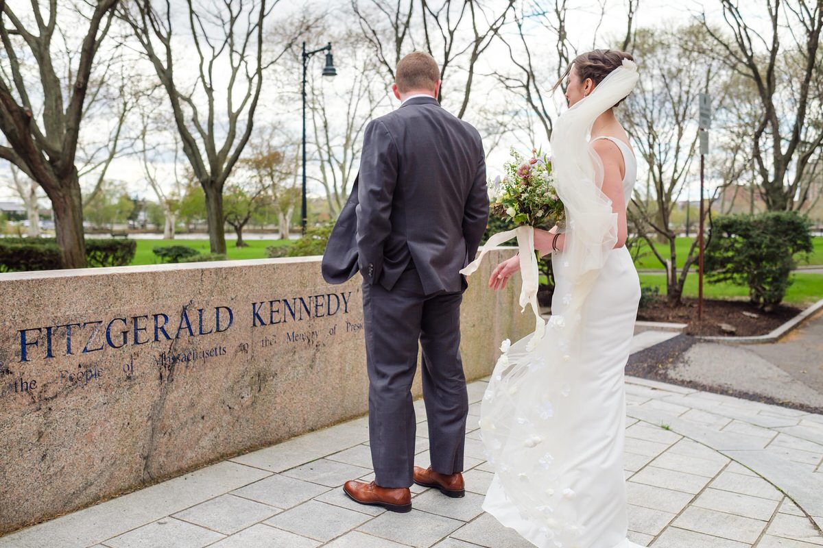 Bride approaches her groom in JFK Park in Cambridge, MA before her first look