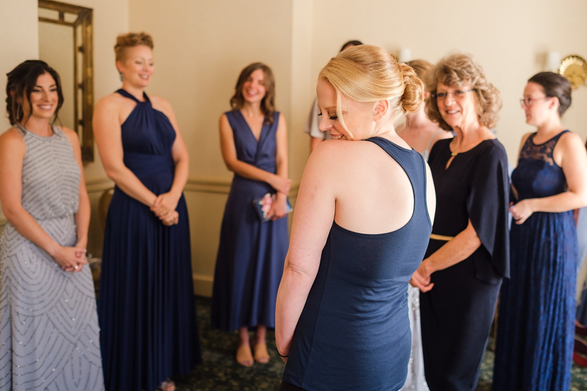 Bride and bridesmaids get wedding ready in a hotel room at the Hawthorne Hotel in Salem, MA