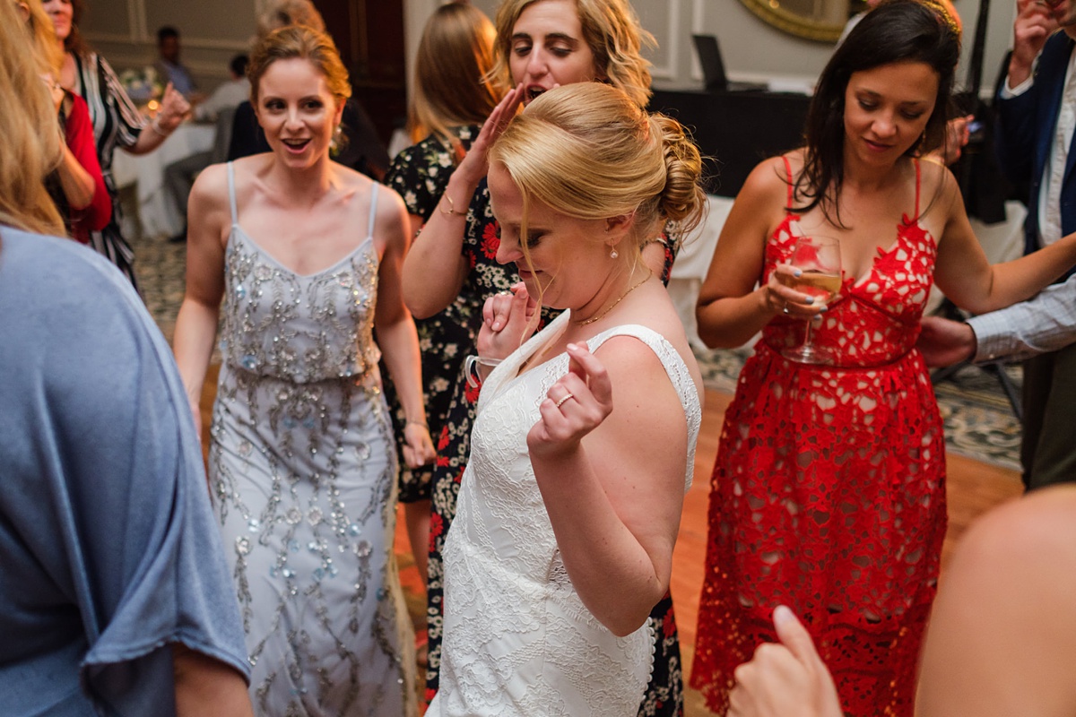 Bride dances with friends at Hawthorne Hotel wedding in Salem, MA