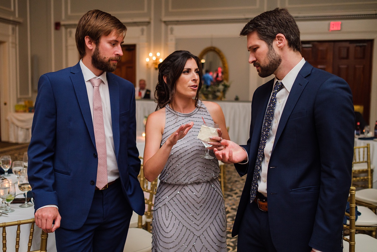 Three Hawthorne Hotel wedding guests talk over drinks