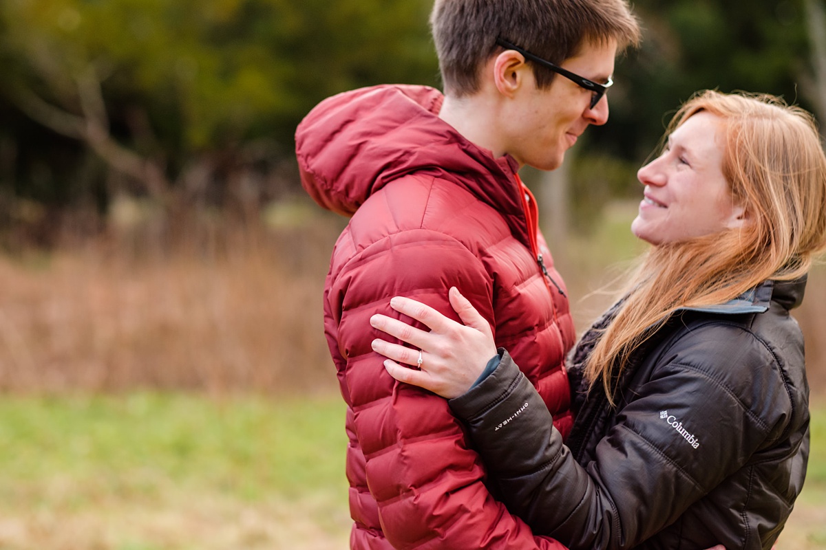 Engaged couple embraces at the Arnold Arboretum in Jamaica Plain