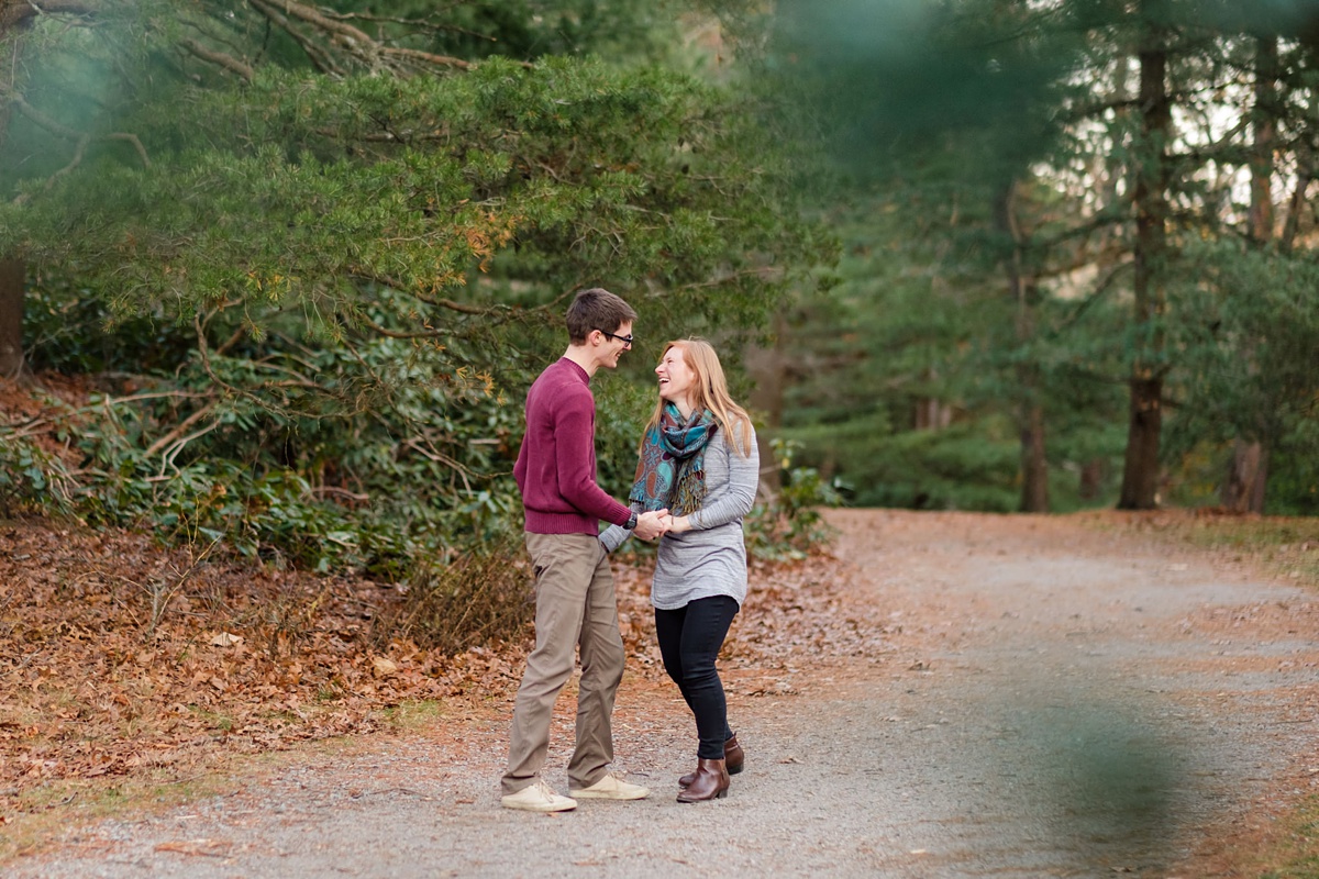 Engaged man and woman dancing in a Boston park