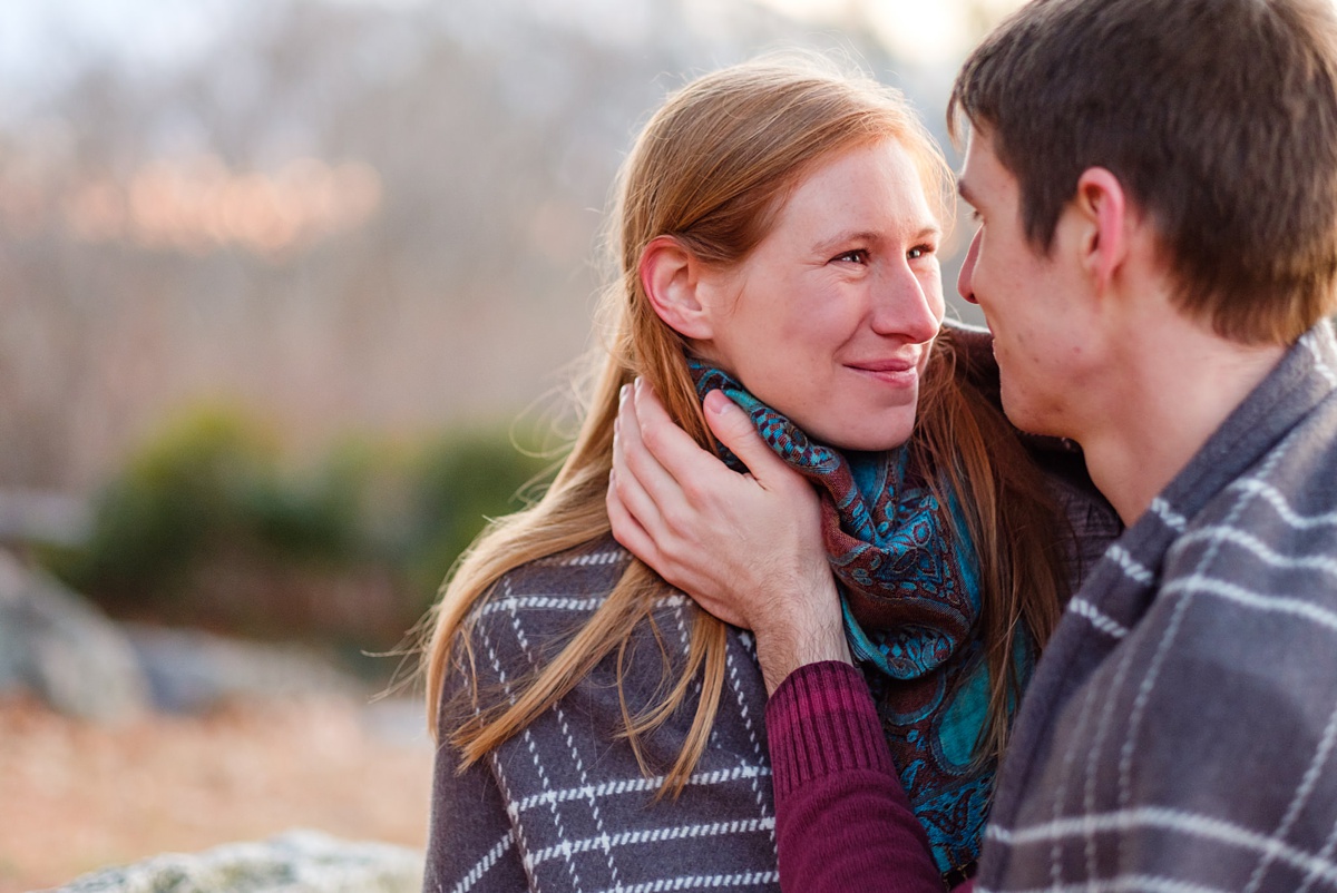 Engaged couple looks into each others' eyes at the Arnold Arboretum in Jamaica Plain