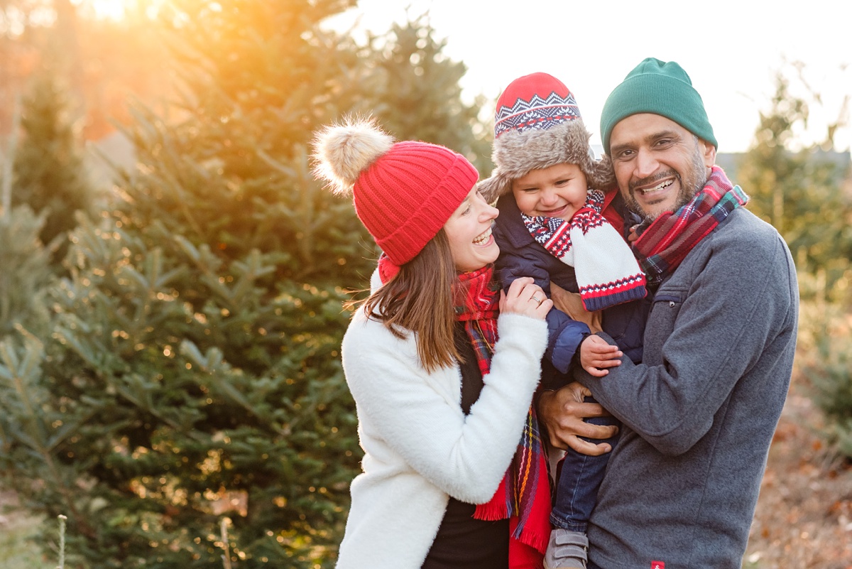 North Shore Christmas tree farm family snuggling and laughing at photo shoot